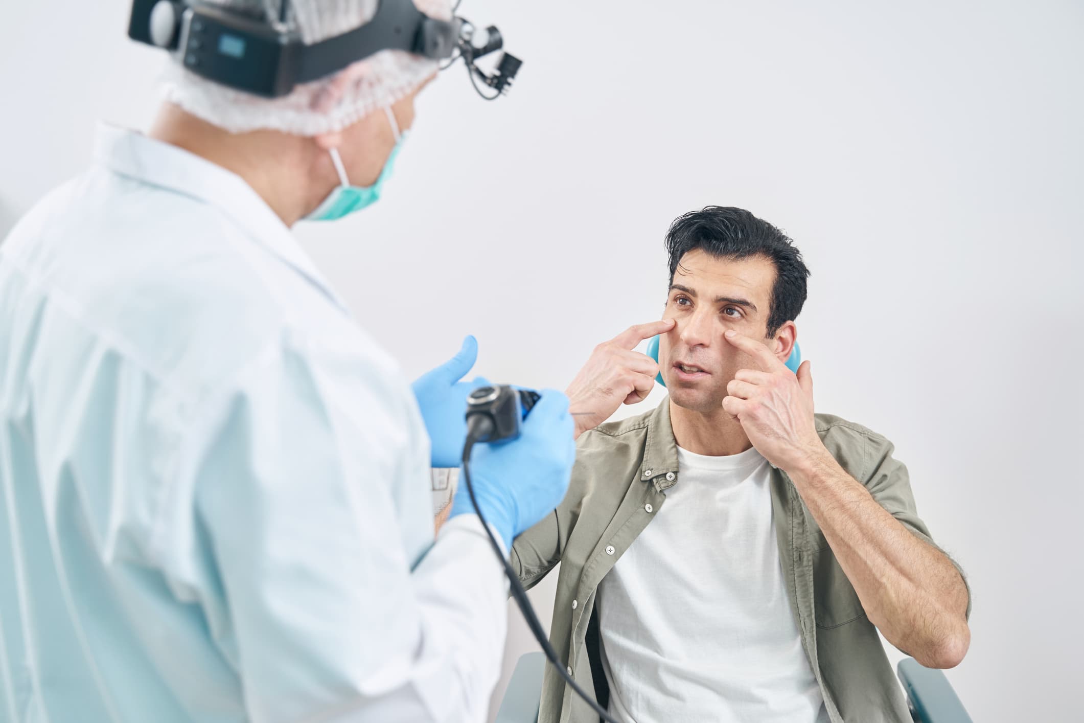 Doctor speaking with patient about septoplasty with valve repair Septoplasty